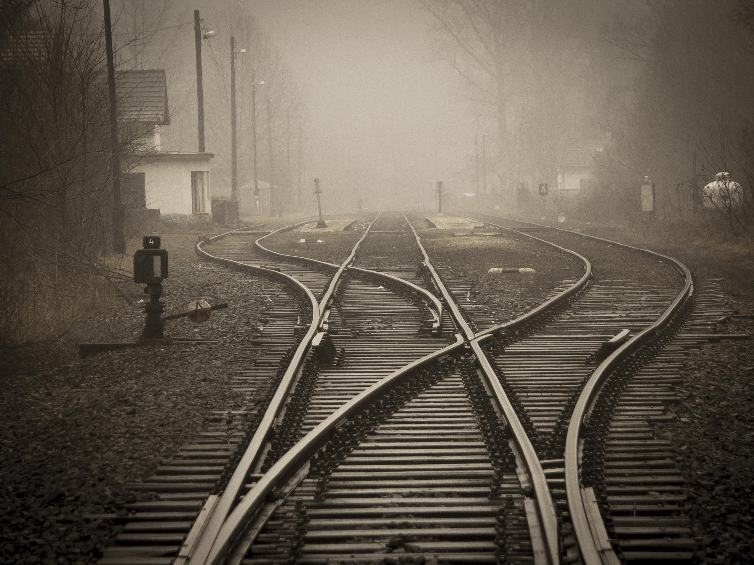 A railway junction symbolizing choices, direction, and the unknown path ahead.